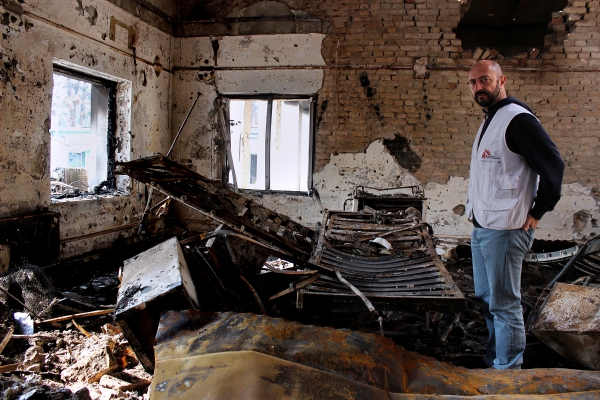 In this photograph taken on November 10 ,2015, a member of Medecins Sans Frontieres (MSF) staff looks on in a charred ward of the damaged Medecins Sans Frontieres (MSF) hospital in northern Kunduz. On October 3, 2015 US forces bombed the MSF Hospital in northern Kunduz, killing at least 30 people, sparking an avalanche of global condemnation and forcing the French-founded charity to close the trauma centre.