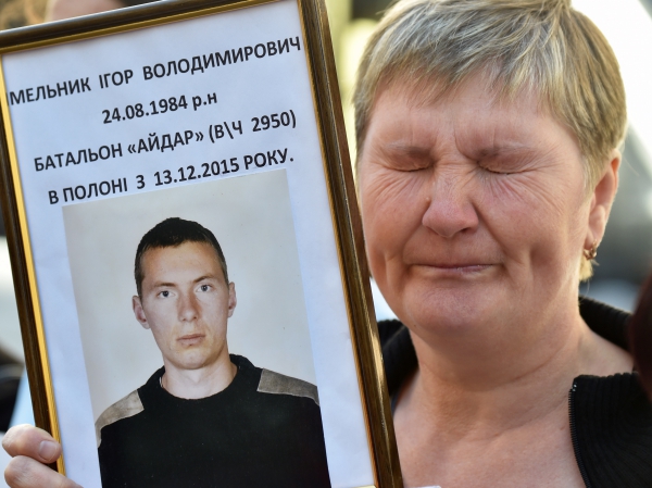 A mother holds the photo of her son, a Ukrainian soldier, held by pro-Russian separatists in Donbass, September 2016