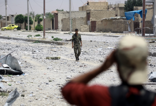Syrian Democratic Forces fighters in part of Raqa retaken from from IS on June 14, 2017