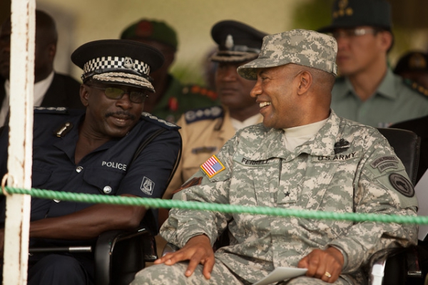 Brigadier General Robert Ferrell shares a laugh with Ousman Sonko, the Inspector General of the Gambian Police, during the opening ceremony for Operation African Endeavor 2011 in Banjul