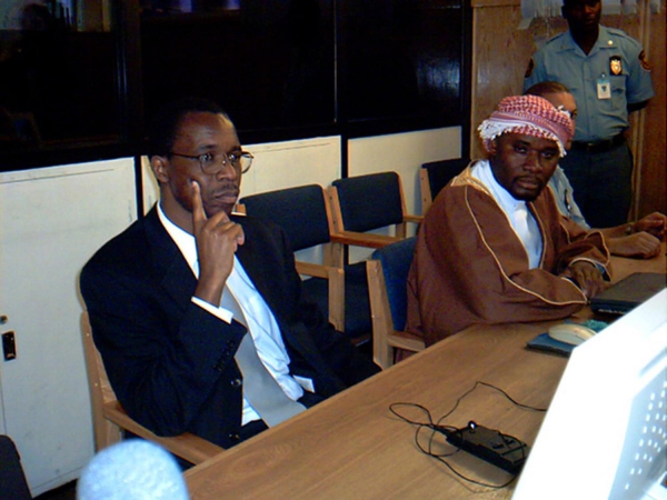 Ferdinand Nahimana (finger on cheek) and Hassan Ngeze at their trial court judgment, December 3, 2003