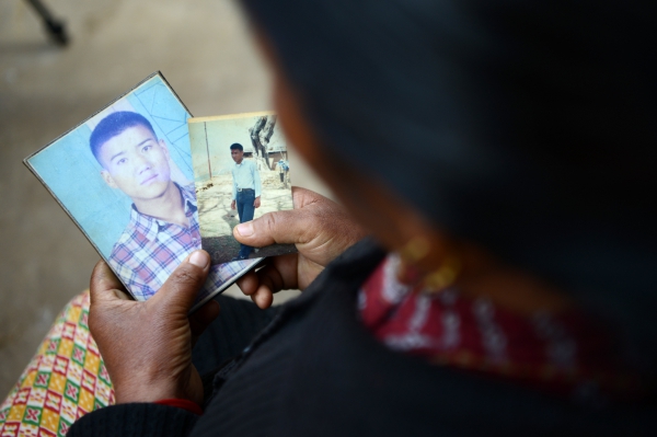 War victim Pabitra Sunakhari shows a photograph of her son who disapeared during the civil war in Nepal