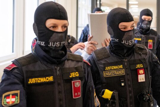 Ex-Syrian general (under Assad regime) defendant Khaled al-Halabi is escorted in handcuffs to the courtroom by justice officers for the trial at the Regional Vienna’s Court of Austria in Vienna, Austria.