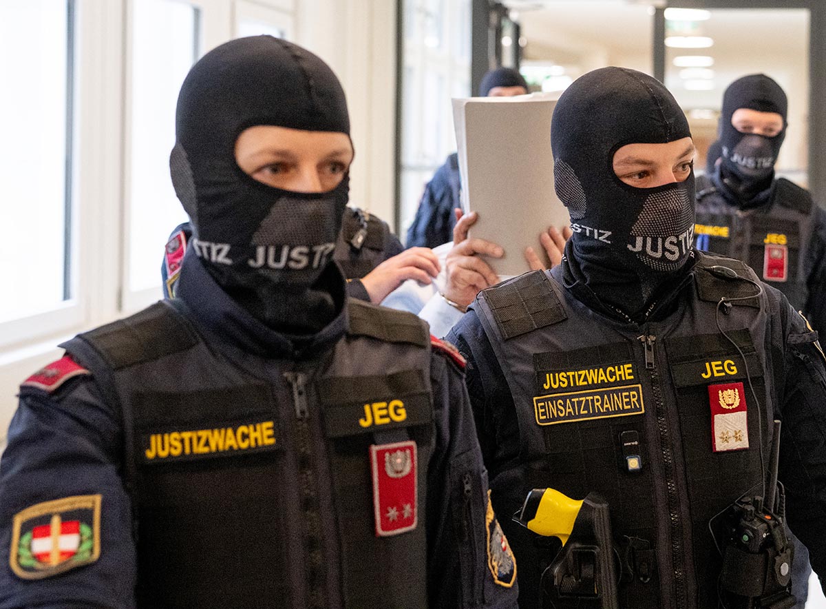 Ex-Syrian general (under Assad regime) defendant Khaled al-Halabi is escorted in handcuffs to the courtroom by justice officers for the trial at the Regional Vienna’s Court of Austria in Vienna, Austria.