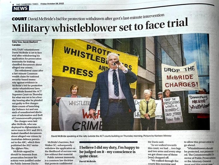 War Crimes in Afghanistan - Article in The Canberra Times (Australia) headlined: 'Military whistleblower set to face trial'. Pictured in the article: David McBride holding a microphone during a demonstration.