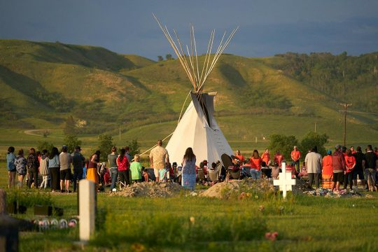 Indigenous ceremony near the graves of children who were victims of Canadian residential schools during the colonial era