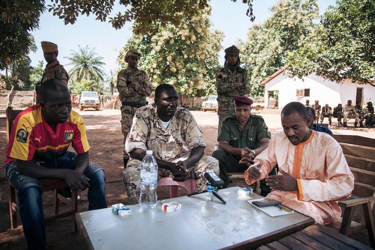 Hassan Bouba, Ali Darassa and other UPC rebels are gathered around a table