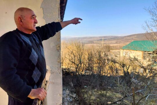 Mevloud Kharazishvili, victim of the war in Georgia and beneficiary of the International Criminal Court (ICC) Trust Fund for Victims assistance programme. Photo: Kharazishvili shows the pasture where he was kidnapped by Russian soldiers.