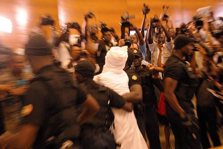 Hissène Habré, surrounded by police and journalists on the first day of his trial, July 20, 2015 in Dakar, Senegal