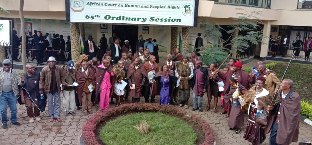 Ogiek people representatives celebrate in front of the African Court on Human and Peoples' Rights.