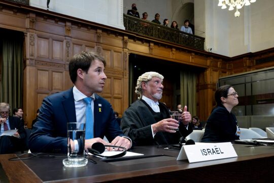 Yaron Wax, deputy head of mission for the Israeli embassy in the Netherlands, British lawyer and member of Israel's legal team, Malcom Shaw KC and Member of Israel's legal team Avigail Frisch Ben Avraham attend a hearing at the International Court of Justice (ICJ) as part of South Africa's request on a Gaza ceasefire in The Hague, on May 24, 2024.