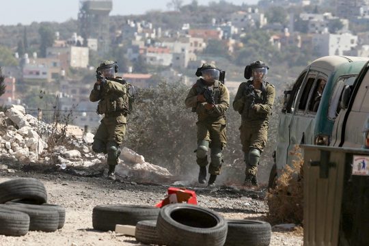 Israeli soldiers patrol in occupied territory (West Bank / Palestine)