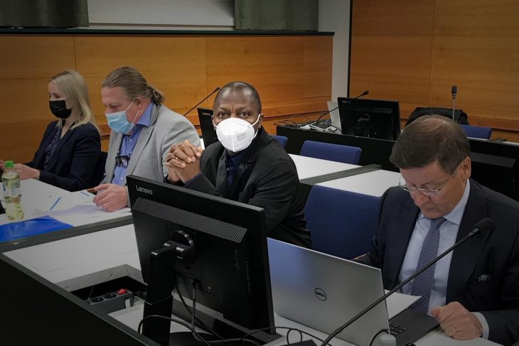 Gibril Massaquoi and his lawyers in the courtroom of Tampere (Finland)