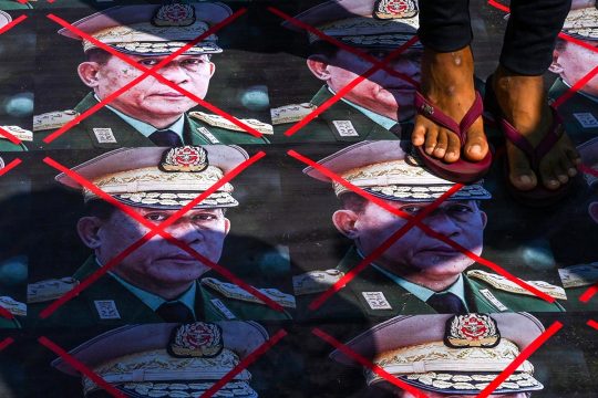 Protesters step on portraits of Myanmar's armed forces chief Senior General Min Aung Hlaing