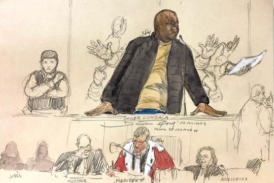 Roger Lumabala was found guilty of complicity in crimes against humanity in the Democratic Republic of Congo (DRC) during a trial in France. Illustration: Lumabala is at the bar, appearing agitated (hand gestures). Also depicted: lawyers, judges and police officers in the courtroom.