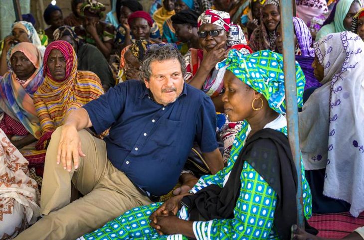 Reed Brody (human rights lawyer) sits among a group of women in Chad, victims of Hissène Habré's dictatorship.