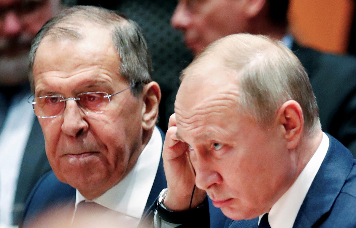 Vladimir Putin and Sergei Lavrov stand side by side in Berlin, Germany in January 2020.