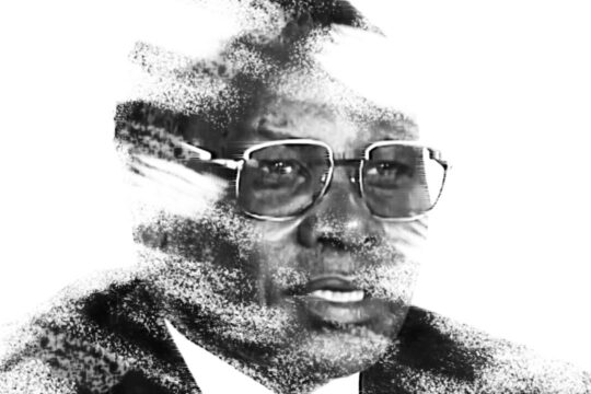 Félicien Kabuga, accused of participating in the genocide of the Tutsis in Rwanda, died before being judged. Image: a portrait photograph of Kabuga that has been digitally altered to make it appear as though the image is fading away.