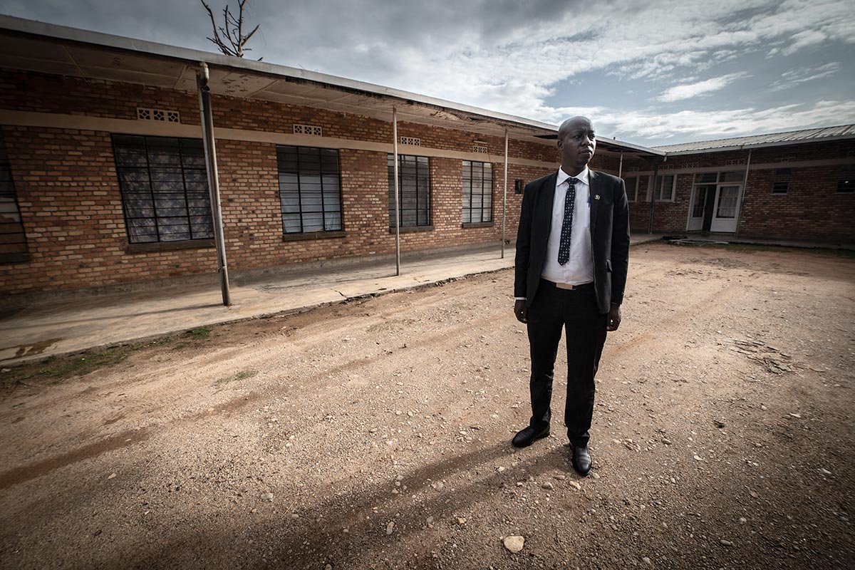 Rémy Kamugire visits the old building where the prefecture meetings were held at the time of the genocide in Nyamagabe, Rwanda.
