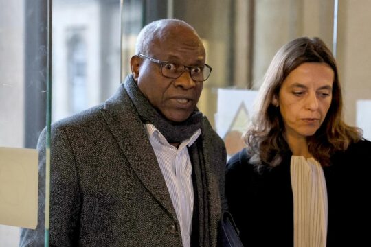 At a trial in France, a Rwandan doctor (Sosthene Munyemana) is convicted of taking part in the 1994 genocide in Rwanda.
