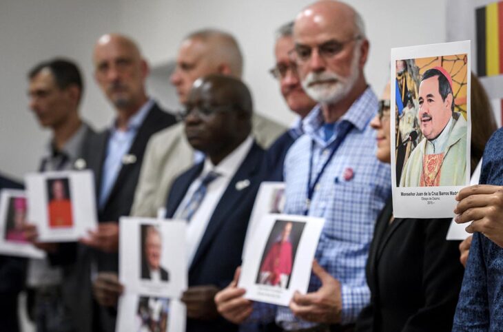 Commission on sexual abuse in the Swiss Church. Photo: Activists from Ending Clergy Abuse pose with portraits of members of the clergy.