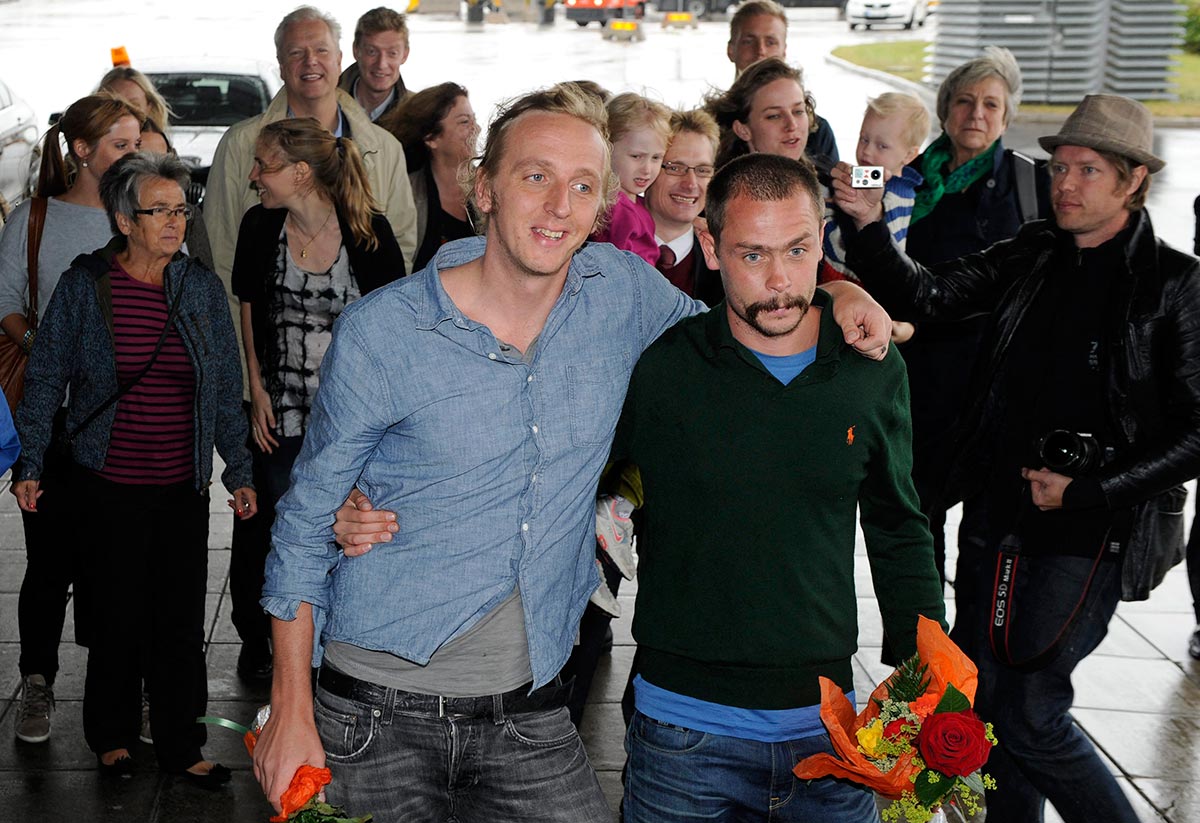 Swedish journalists Martin Schibbye and Johan Persson arrive at Stockholm airport on 14 September 2012 after their release from an Ethiopian prison.