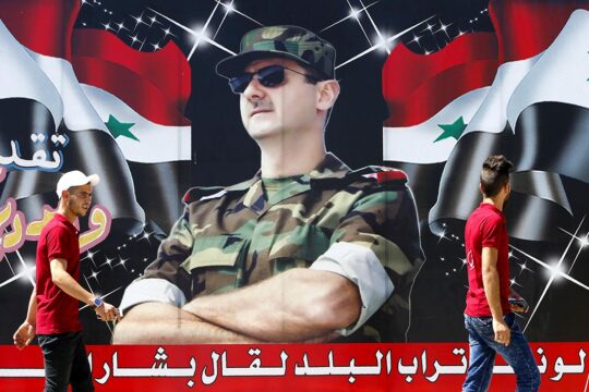Procès syrien en France. Photo : affiche de Bachar el-Assad dans une rue de Damas en Syrie.