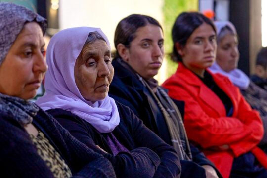 Members of the Yazidi community watch the verdict of the District Court of The Hague in the Hasna A. case via livestream at the Yazda office in Sinjar (Iraq)