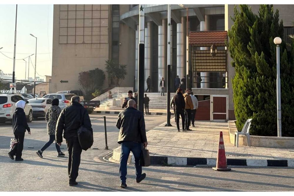 Aleppo courthouse, with people entering the building during the first hearing of the trial on the March 2025 violence on the Syrian coast, photographed in November 2025.