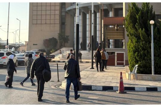 Aleppo courthouse, with people entering the building during the first hearing of the trial on the March 2025 violence on the Syrian coast, photographed in November 2025.