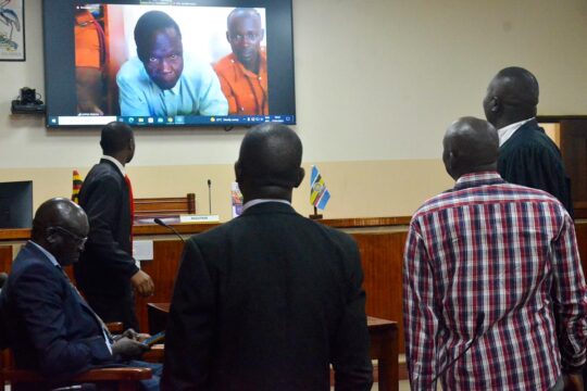 Thomas Kwoyelo's trial in Uganda - He appears on video on television during a hearing he is unable to attend.