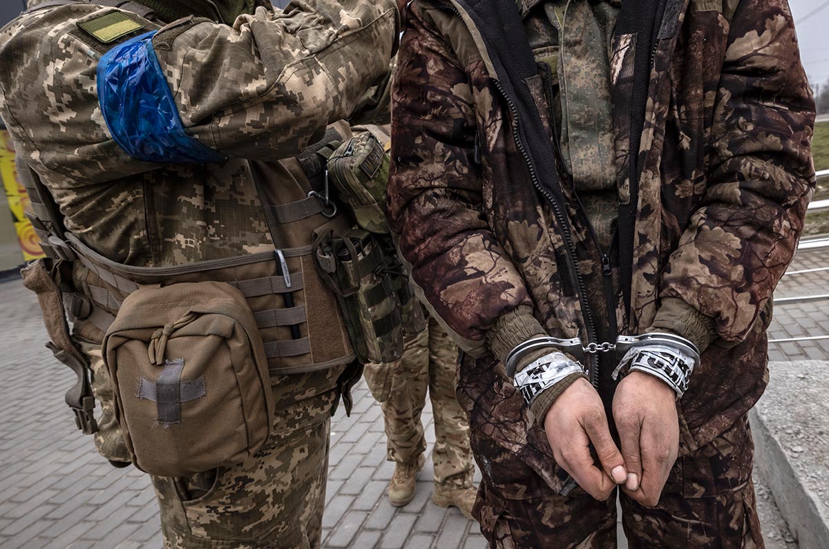 Crimes against prisoners of war in Ukraine can both sides be tried?