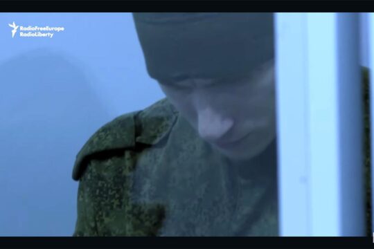 Dmitriy Kurashov, a Russian soldier, was sentenced to life imprisonment in Ukraine for executing an unarmed Ukrainian soldier. Image (video capture): Kurashov lowers his head in the dock during his trial.