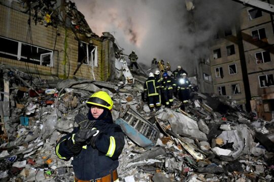 Looking for the missing in Ukraine - Ukrainian rescuers after the destruction of a residential building in Dnipro (Ukraine) by a missile strike.