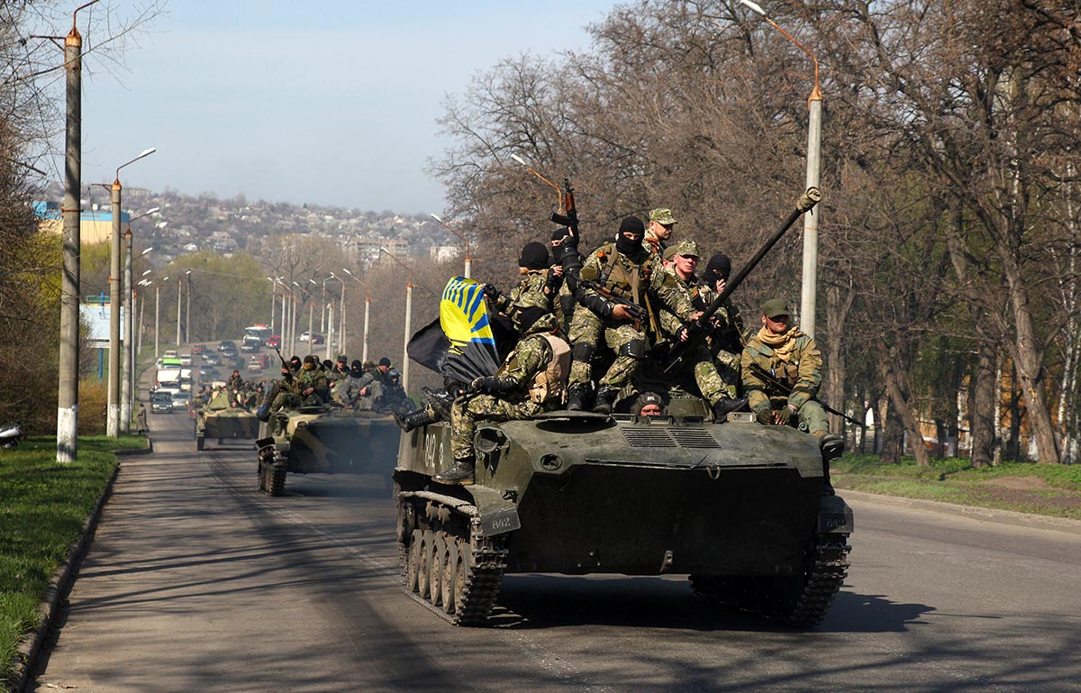Tanks driven by pro-Russian separatist fighters parade in eastern Ukraine.